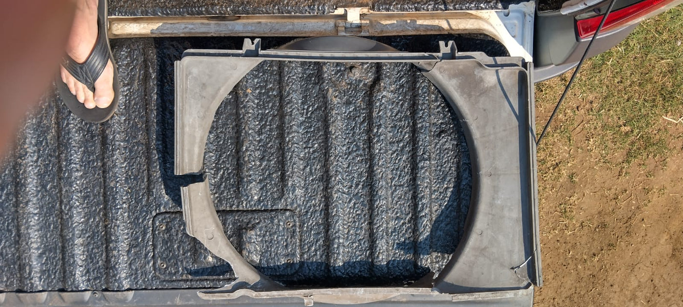 Broken original 2003 Isuzu radiator shroud used as the reverse-engineering reference