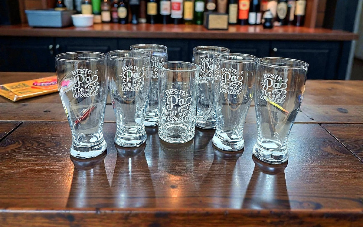 Create It 3D custom laser engraved beer glasses displayed in a South African bar