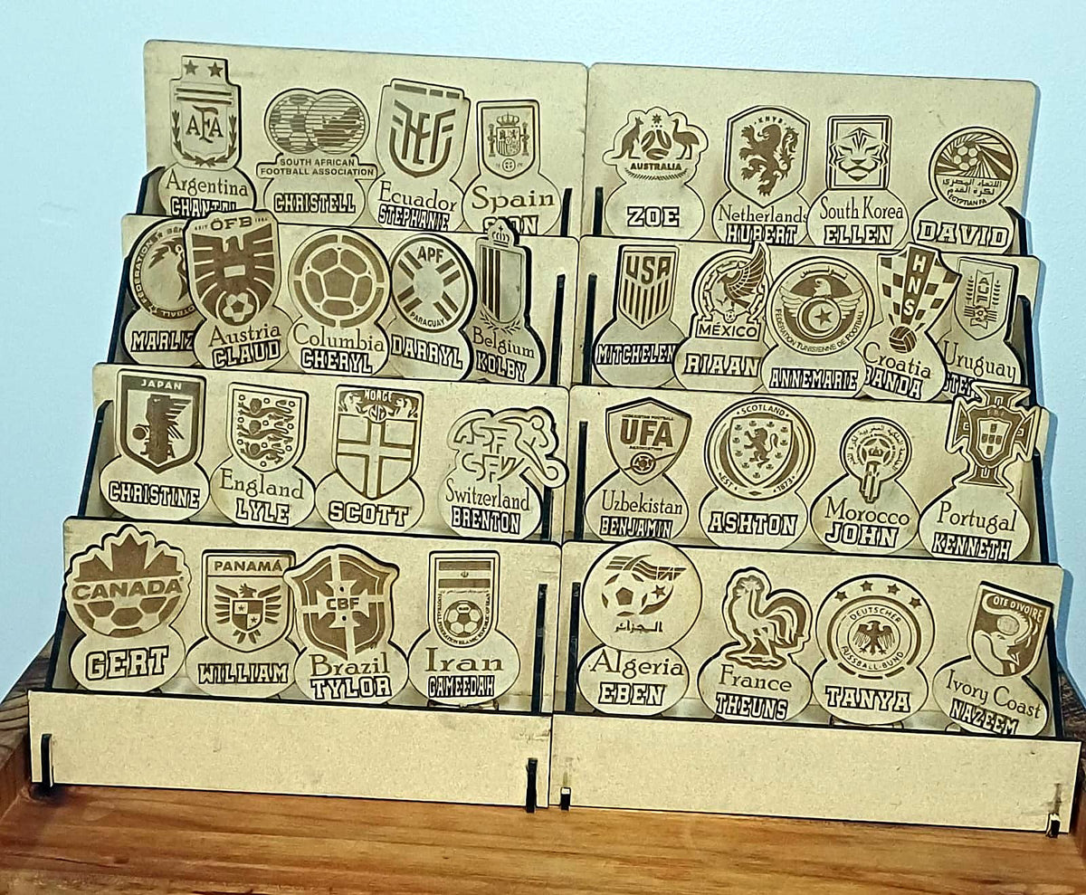Collection of detailed laser engraved timber badges and emblems