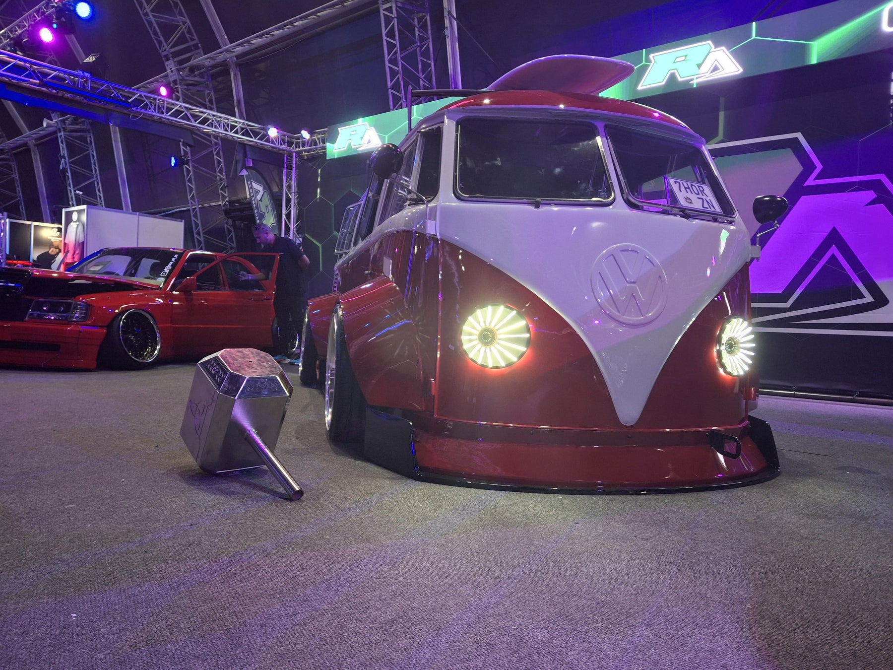 Custom lit 3D printed headlights installed on a VW bus at the Gas Motor Show