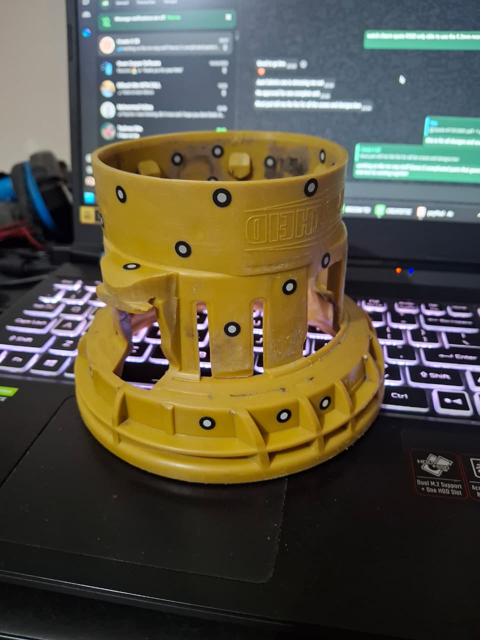 Original PTO boot component prepared for 3D scanning with reference markers