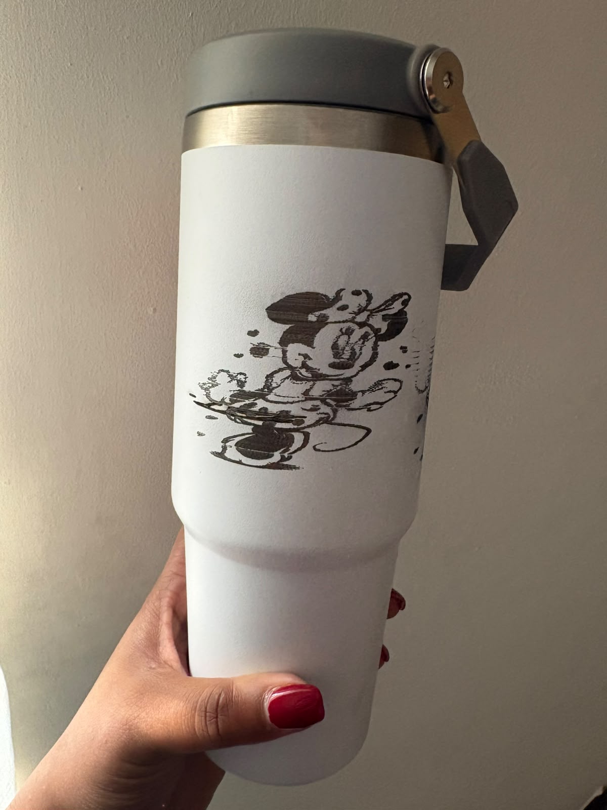 Personalised engraved travel tumbler made with a rotary laser attachment